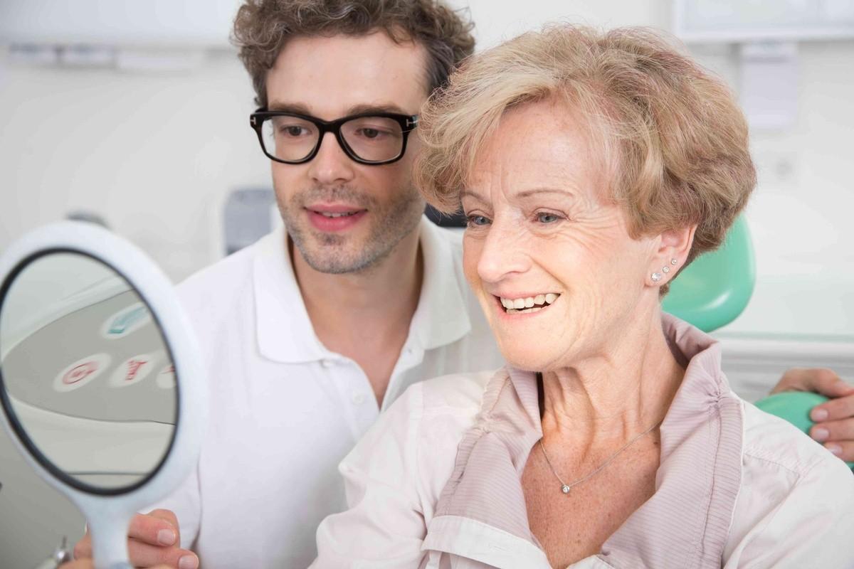 Patient discussing dental bridge options for replacing missing teeth with a dentist