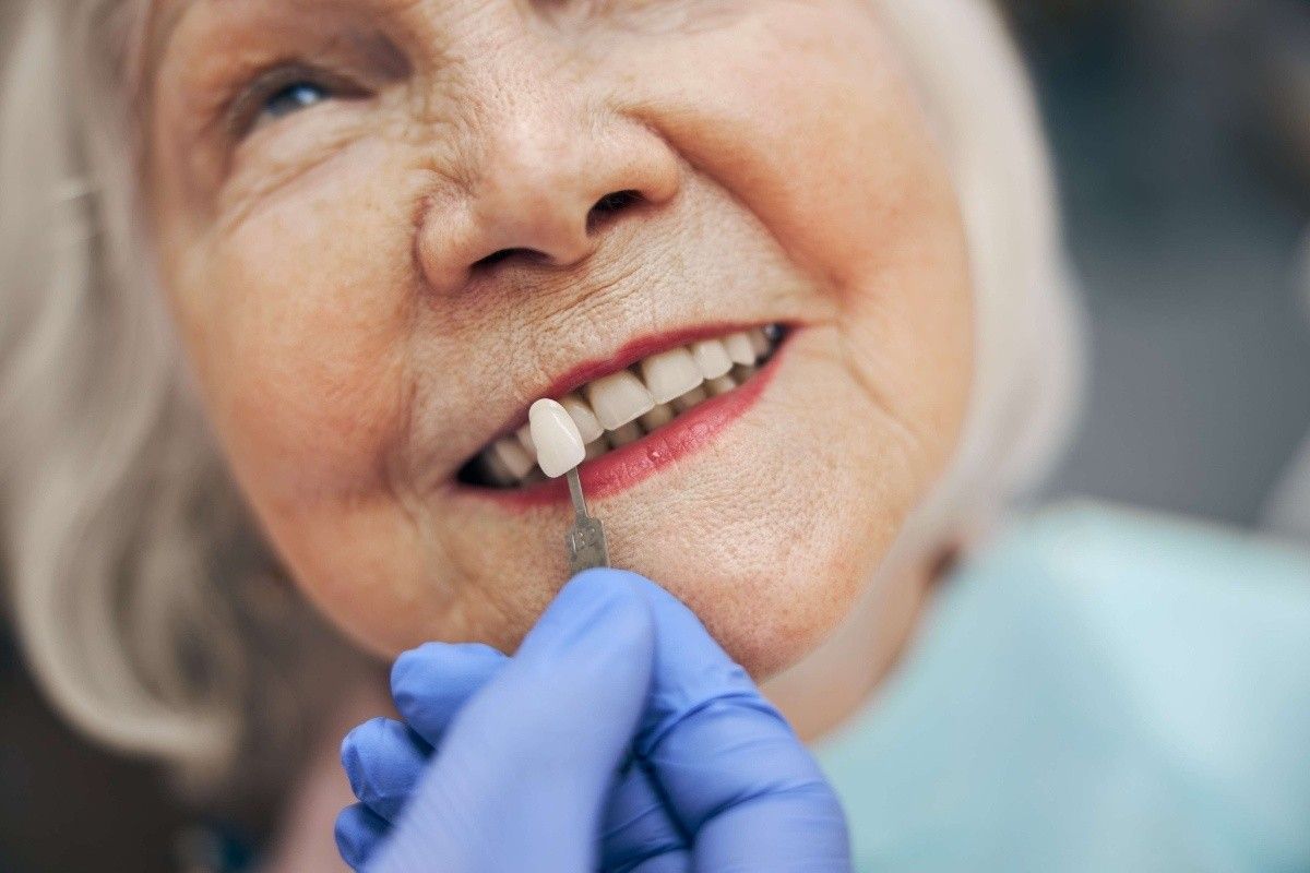 Patient reviewing veneer shade options during a cosmetic dental visit